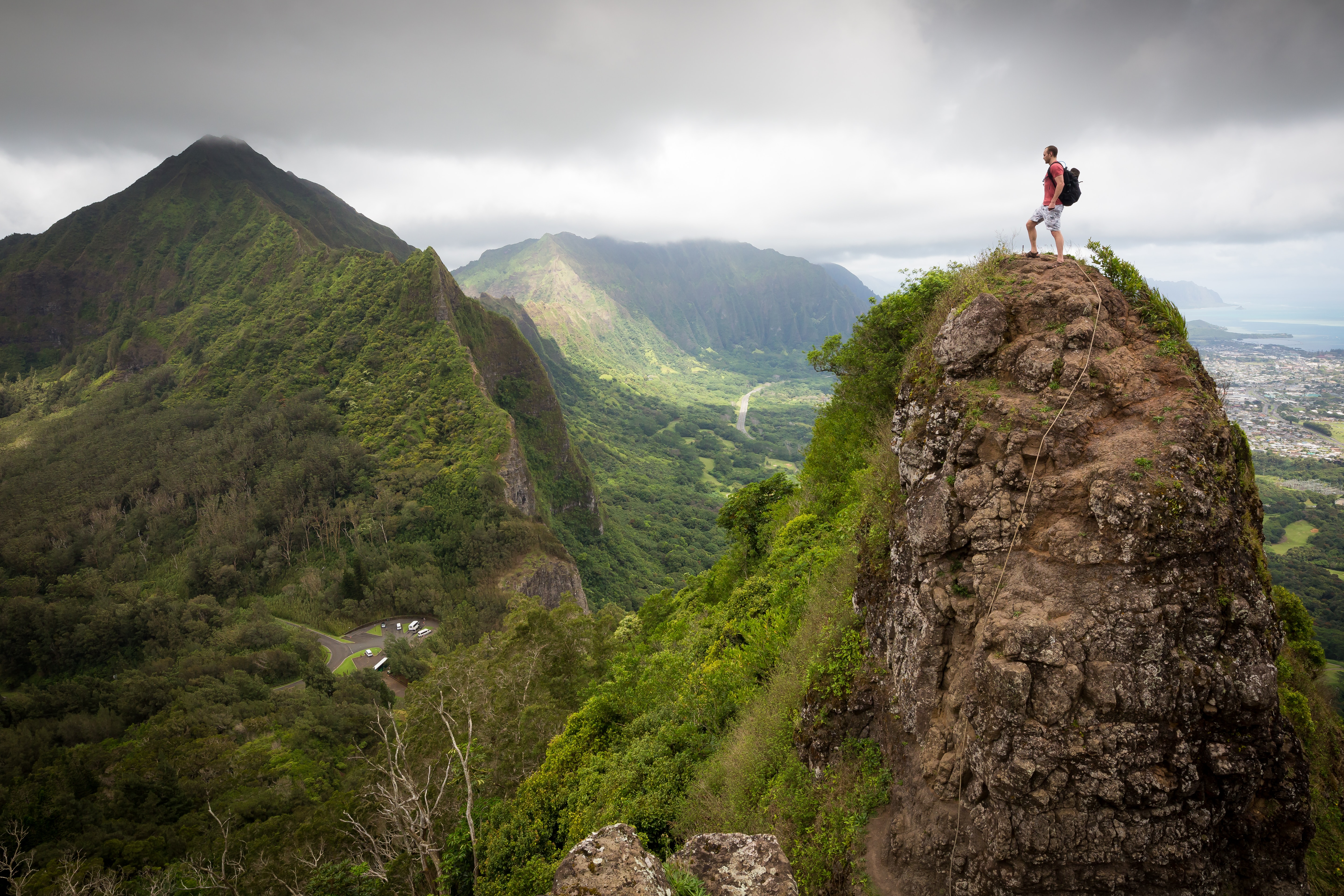 man on green mountain summit