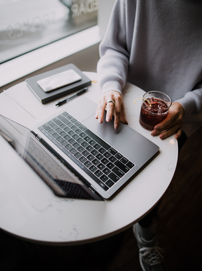 person sitting at a desk with a laptop
