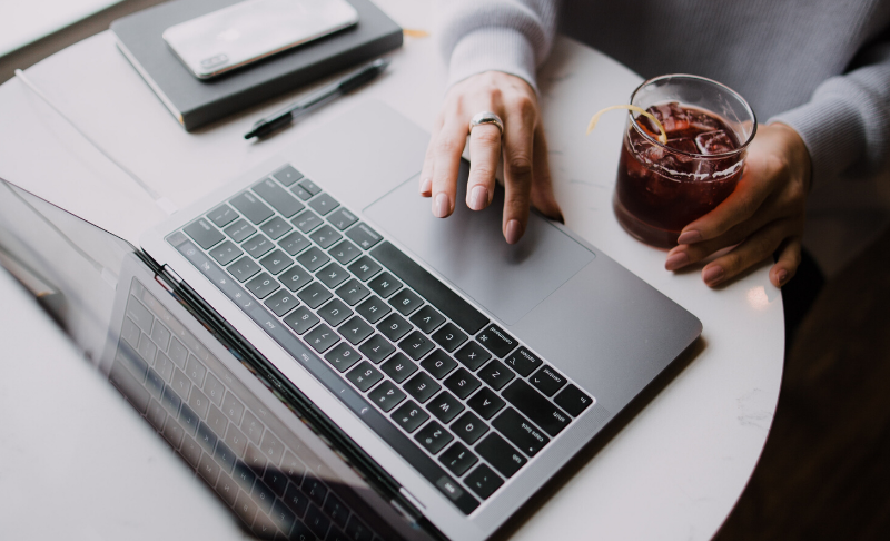 person sitting at a desk with a laptop