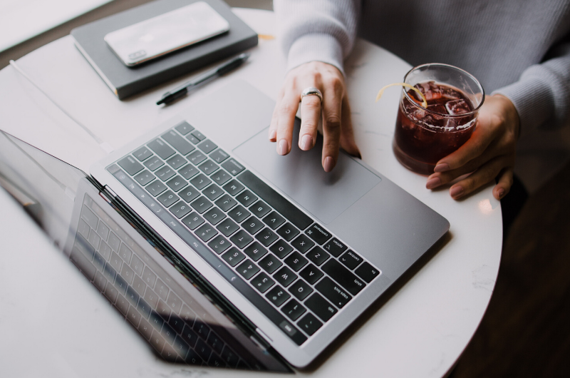 person sitting at a desk with a laptop