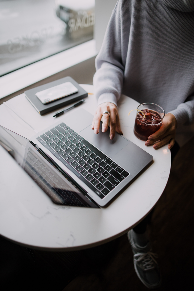 person sitting at a desk with a laptop