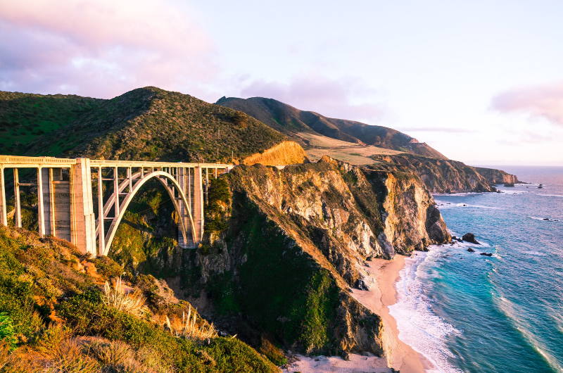 bridge overlooking cliff and ocean