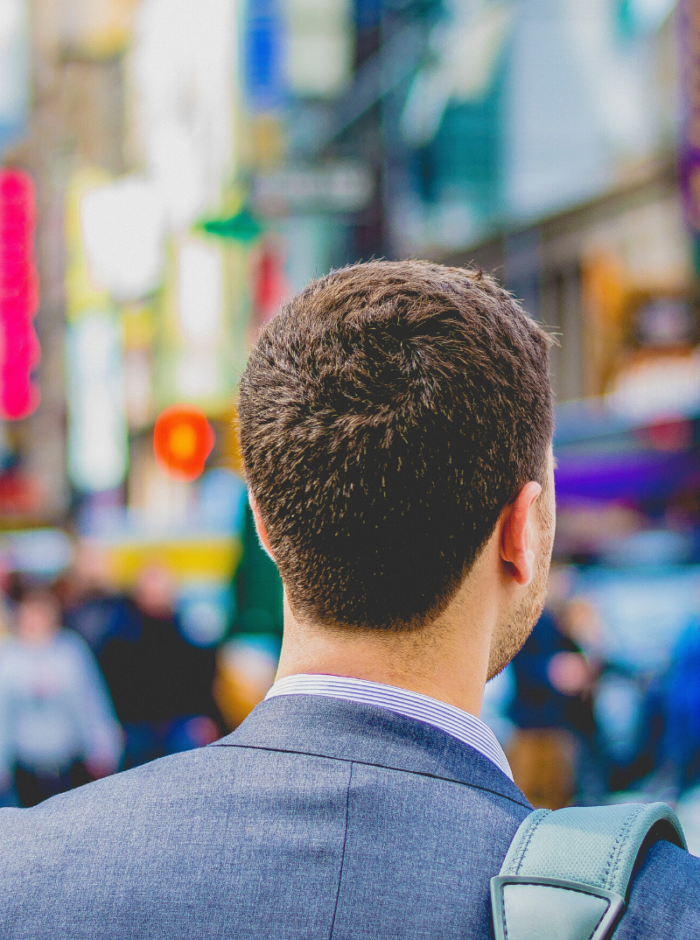 man looking forward wearing a suit