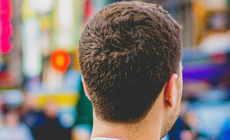 man looking forward wearing a suit