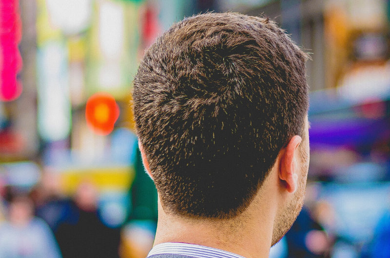 man looking forward wearing a suit