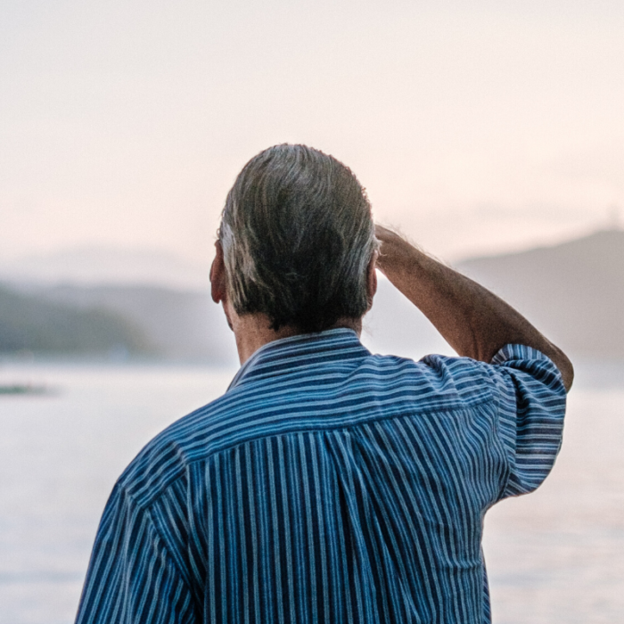 older man looking out to the sea