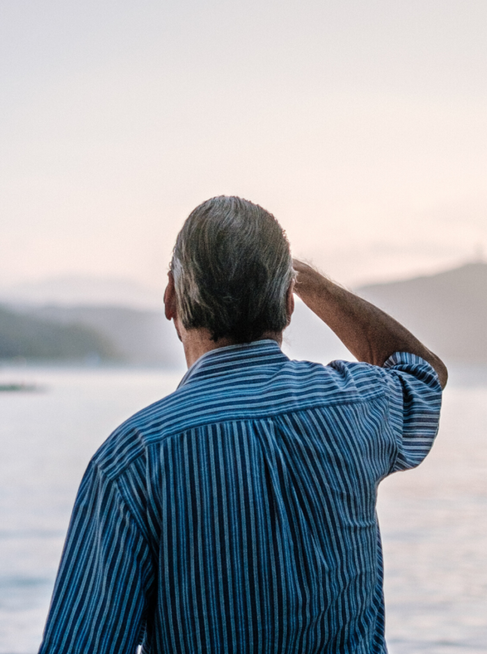older man looking out to the sea