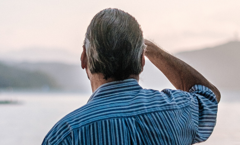 older man looking out to the sea