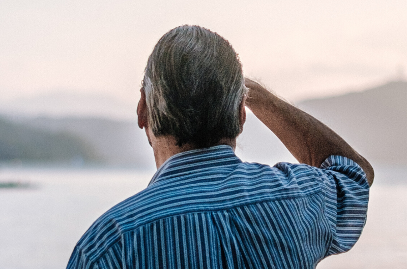 older man looking out to the sea