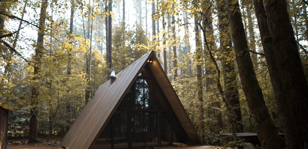 a frame cabin in woods