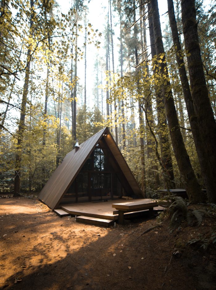 a frame cabin in woods
